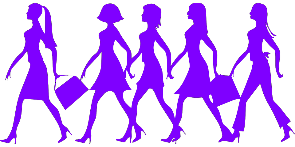 Silhouettes of women walking
