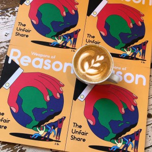 Cover of magaizne Weapons of Reason with coffee cup on top