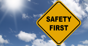 Safety first sign against blue sky